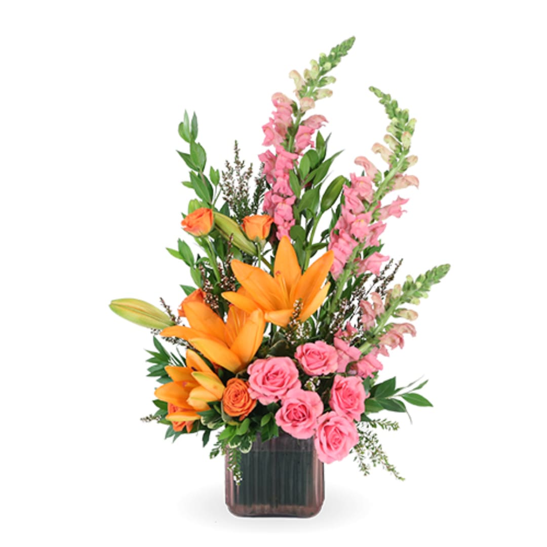 Orange lilies and pink roses in a dark glass vase