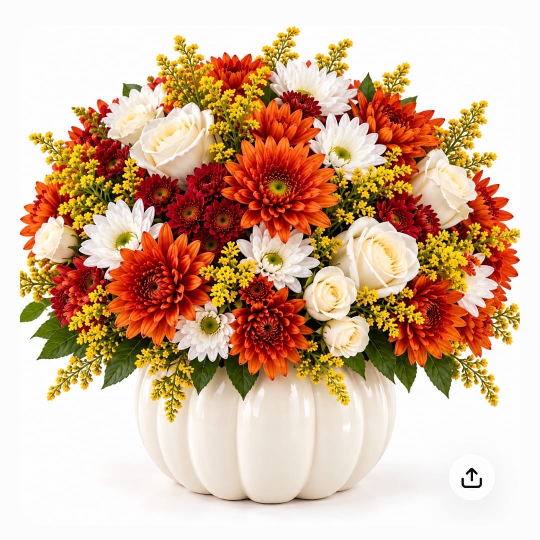 Orange and white flowers arranged in a white pumpkin-shaped vase