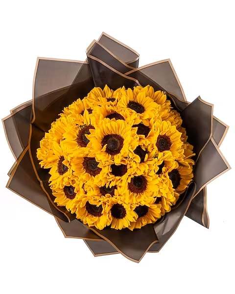 Bouquet of yellow sunflowers wrapped in dark brown paper