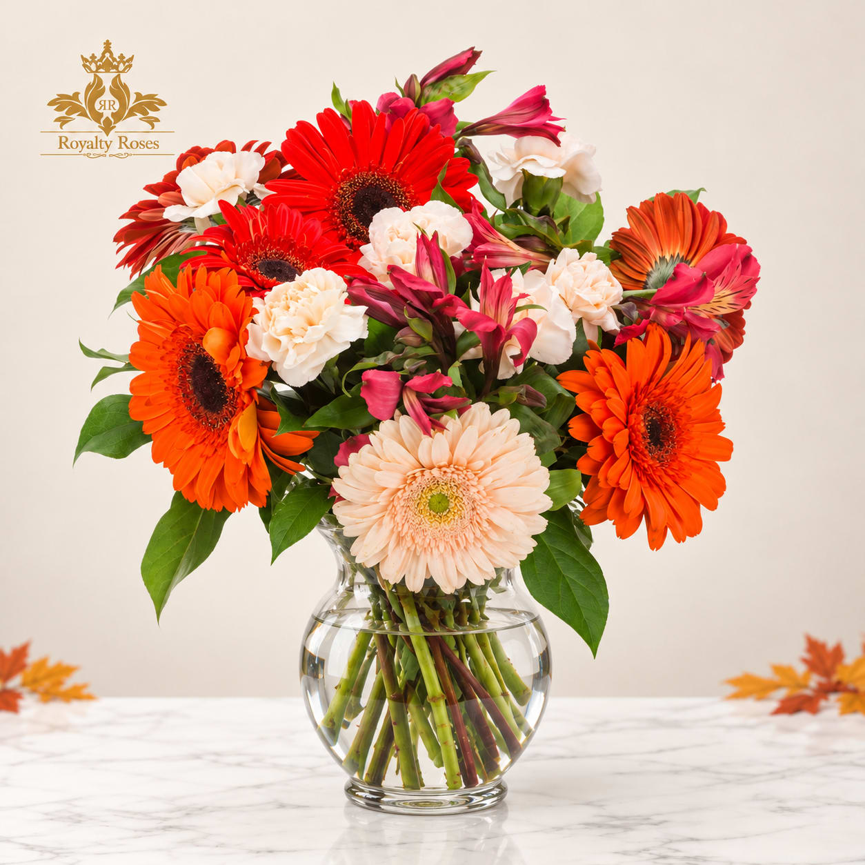 Mixed gerbera daisies and alstroemeria in a clear glass vase