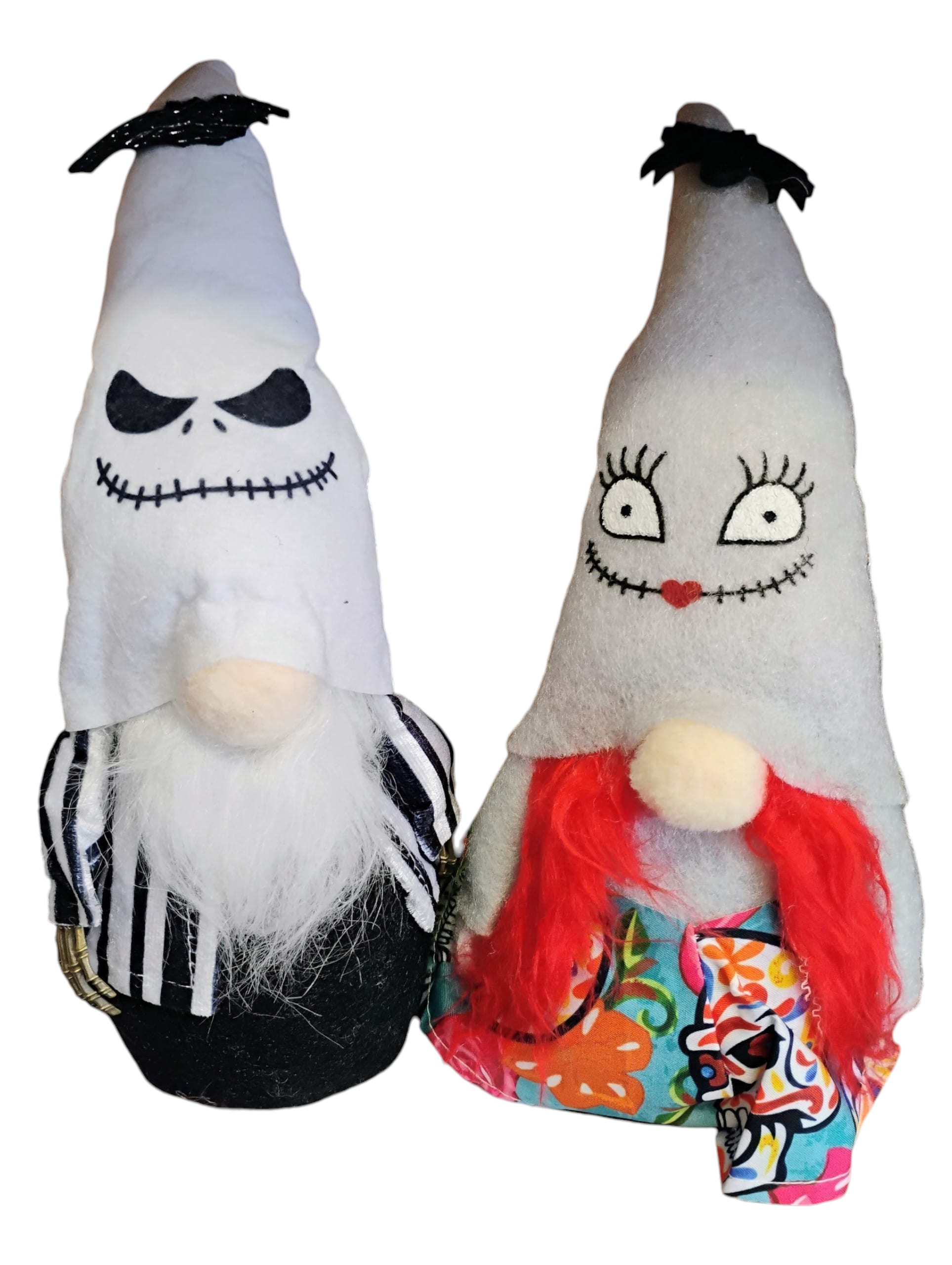 Nightmare Gnome Duo - Jack &amp; Sally’s Twisted Tiny Twins - Step aside, basic Halloween décor—this ghoulishly glam gnome pair is serving Nightmare Before Christmas realness with a boutique twist. Inspired by the iconic love story of Jack and Sally, these stitched-up sweethearts are hauntingly adorable, unapologetically weird, and ready to take center stage in your spooky setup.  Jack channels full Pumpkin King energy with stitched smirks, skeletal charm, and monochrome stripes that scream “I run Halloween and Christmas.” Sally is stitched with soul—red yarn hair, patchwork whimsy, and lashes that could kill (or at least enchant your guests). Her outfit’s a psychedelic swirl of spooky florals and sugar skull sass.  ️ Why You Need Them: - They’re the perfect fusion of creepy and cute—ideal for mantels, tiered trays, boutique shelves, or your haunted love nest. - Handmade vibes with high-impact flair. These aren’t mass-market knockoffs—they’re boutique-born, stitched with intention, and dripping in character. - Whether you’re a Tim Burton devotee, a gnome hoarder, or just vibing with spooky romance, this duo delivers drama, nostalgia, and shelf appeal. - The ultimate gift for Halloween lovers, gnome collectors, or that one friend who quotes “What’s This?” year-round. Wrap them up and watch someone scream with delight.