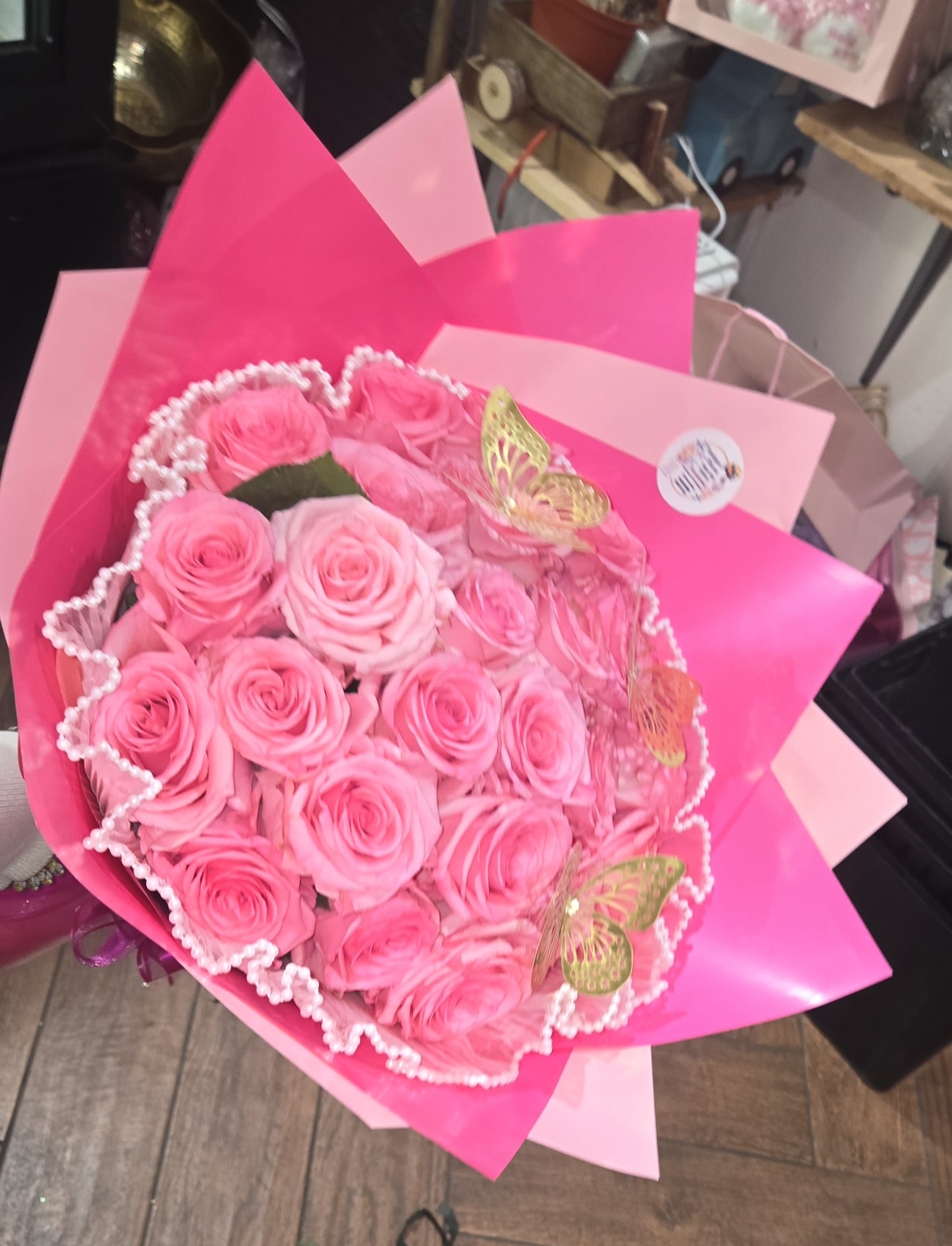 Bouquet of pink roses wrapped in bright pink paper