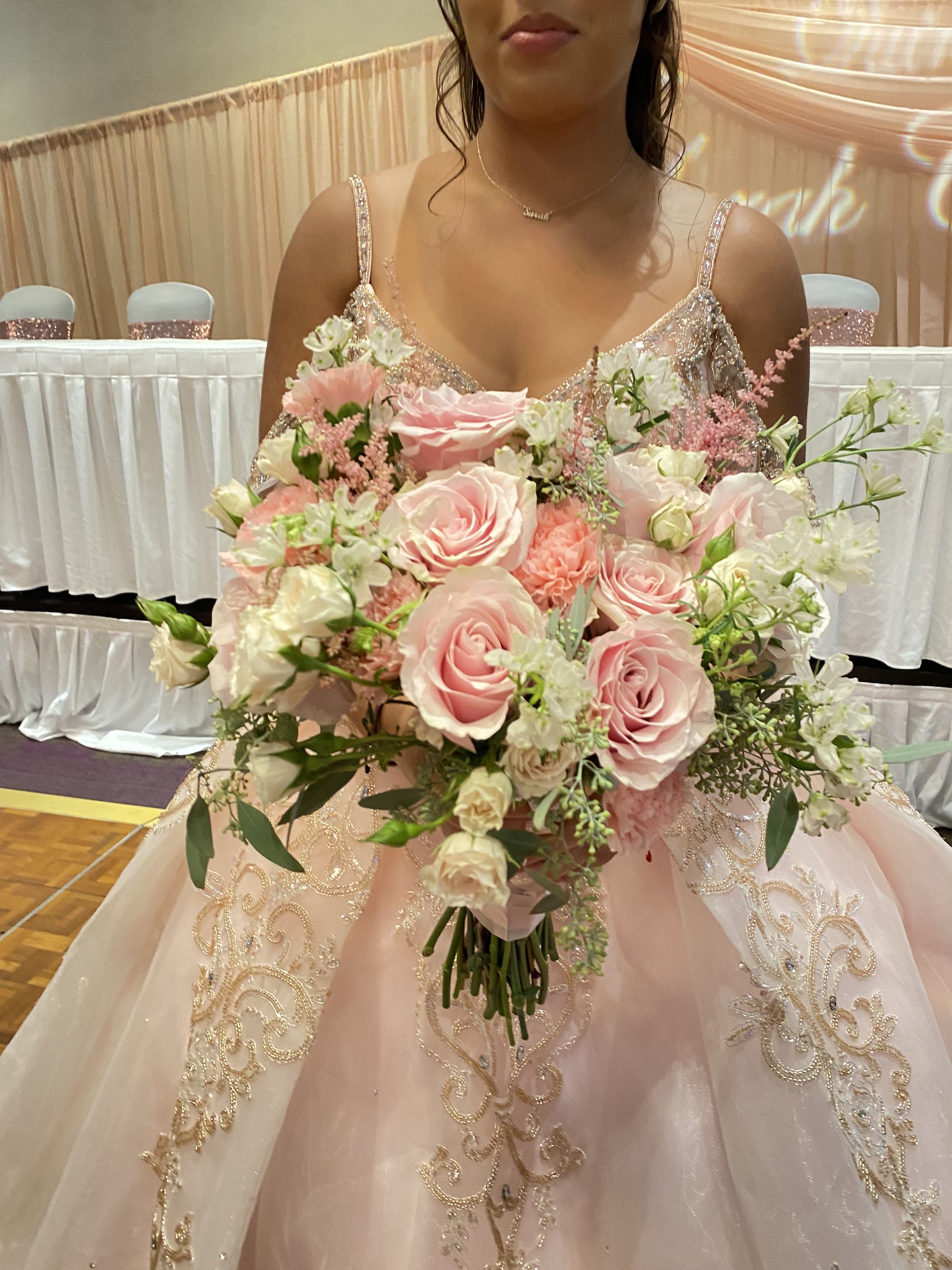 Bride holding a large pink and white bouquet