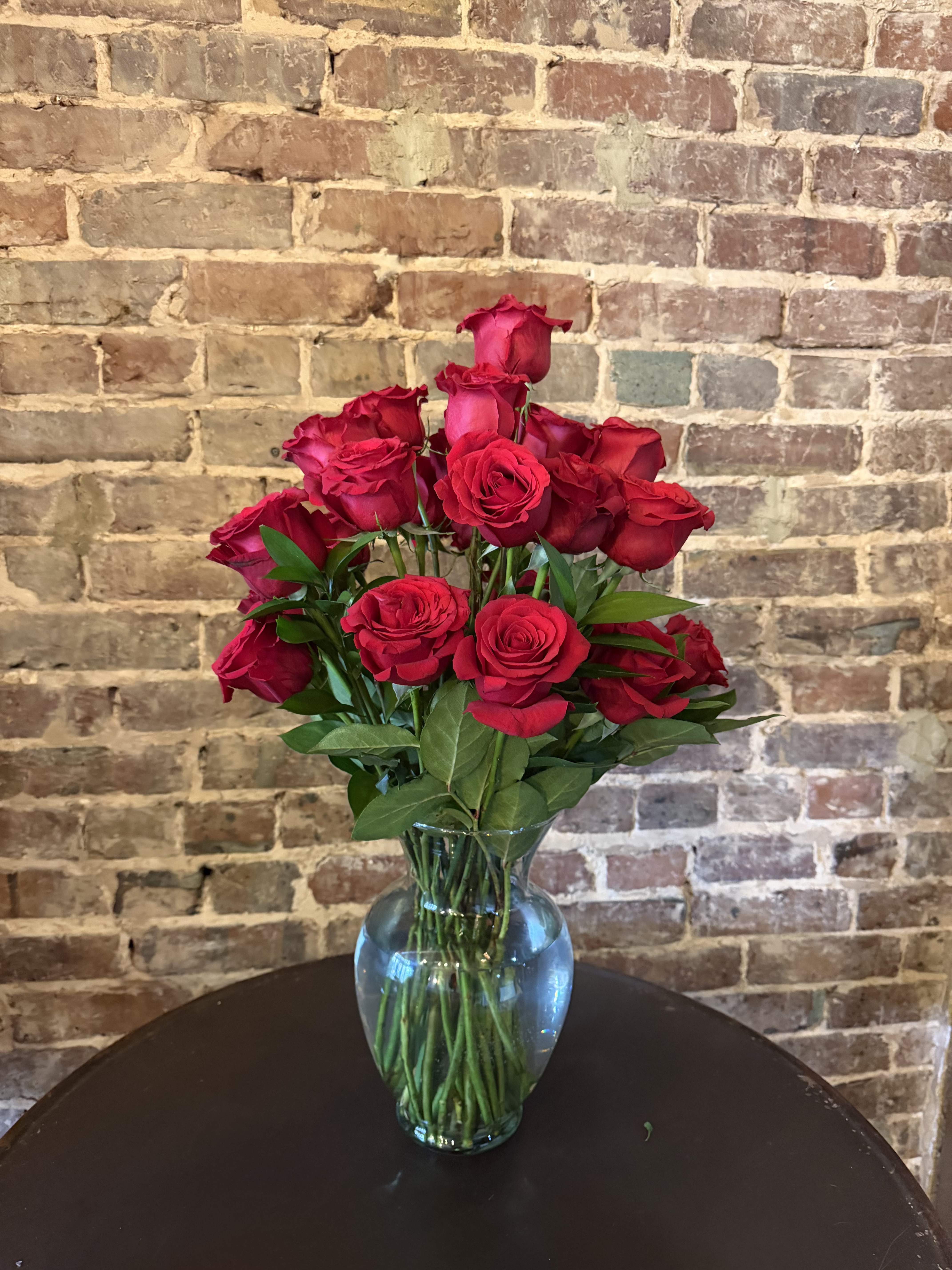Bouquet of red roses in a clear glass vase