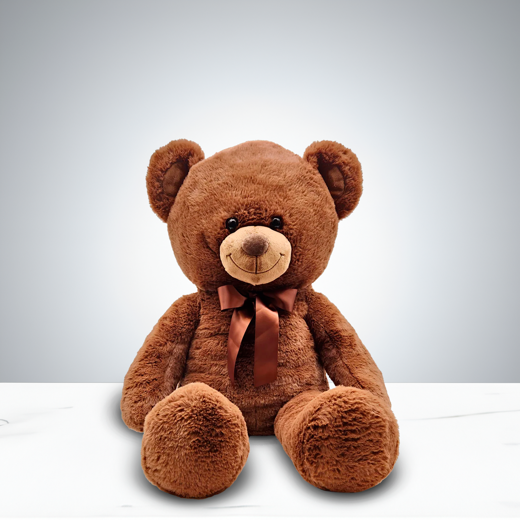 Jumbo Bear Plush - This jumbo brown teddy bear is a heartwarming Valentine’s gift, designed to impress with its generous size and irresistible softness. Adorned with a charming bow, it combines cuddly comfort with durable craftsmanship, making it a keepsake that will be cherished for years.