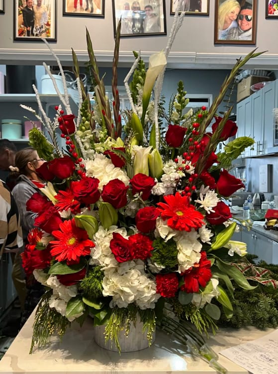 Lady in red - Stunning Arrangement of white  hydrangeas, Cala Lilies, oriental lilies lisiuntus and full of red roses in a beautiful elegant ceramic container 