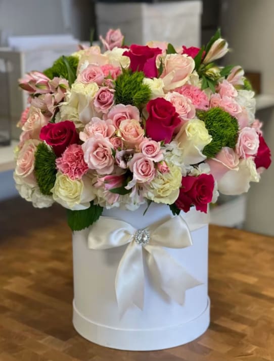 Box of dreams  - Sunning white hat ox with pink, red roses and hydrangeas and a touch of green dyantus also available in 3 or more sizes 