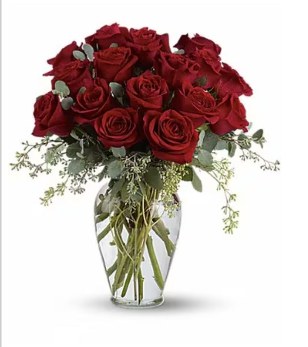 Bouquet of red roses in a clear glass vase