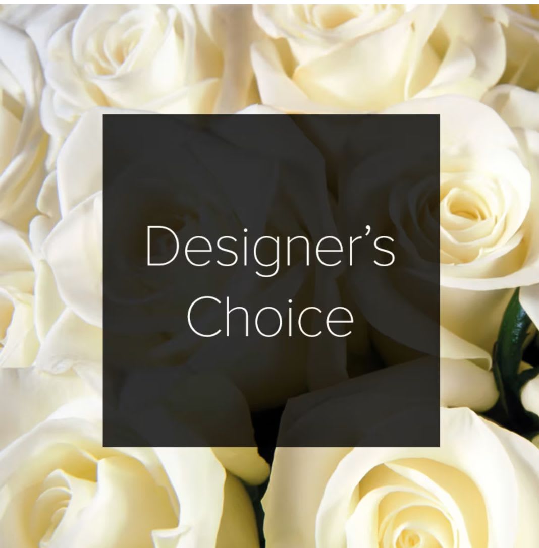 Cream-colored roses with a centered Designer's Choice label