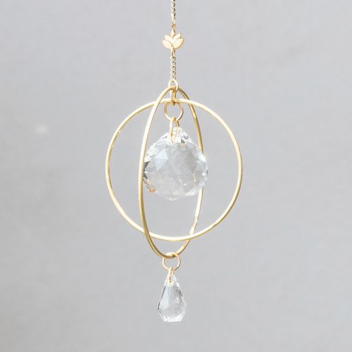 Gold hanging ornament with faceted clear crystal sphere and teardrop on a delicate chain