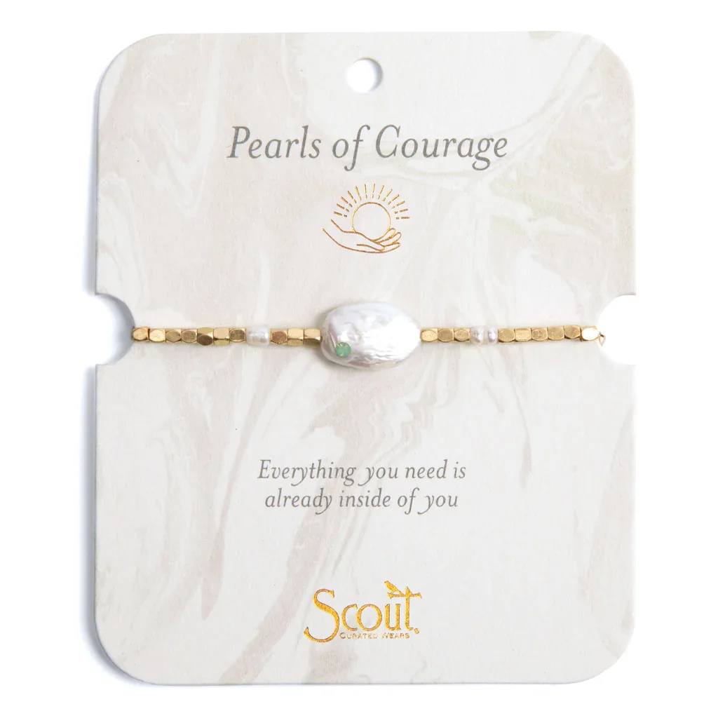 Gold beaded bracelet with a large white pearl on a decorative card labeled Pearls of Courage.