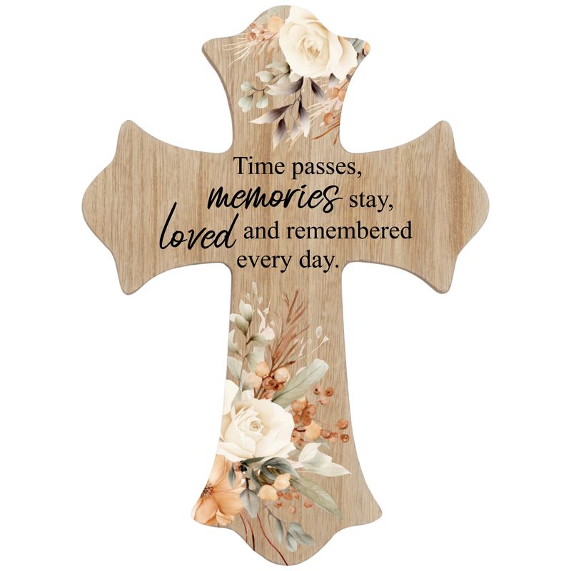 Wooden cross plaque with cream and peach floral design and a memorial quote in black script text.