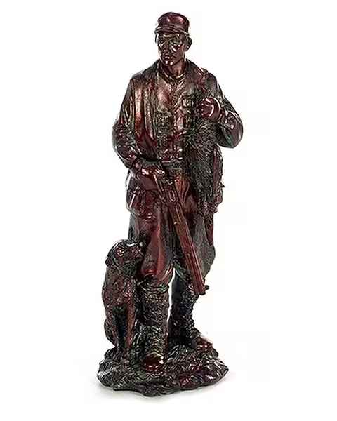 Bronze-tone figurine of a hunter with a rifle and dog by his side