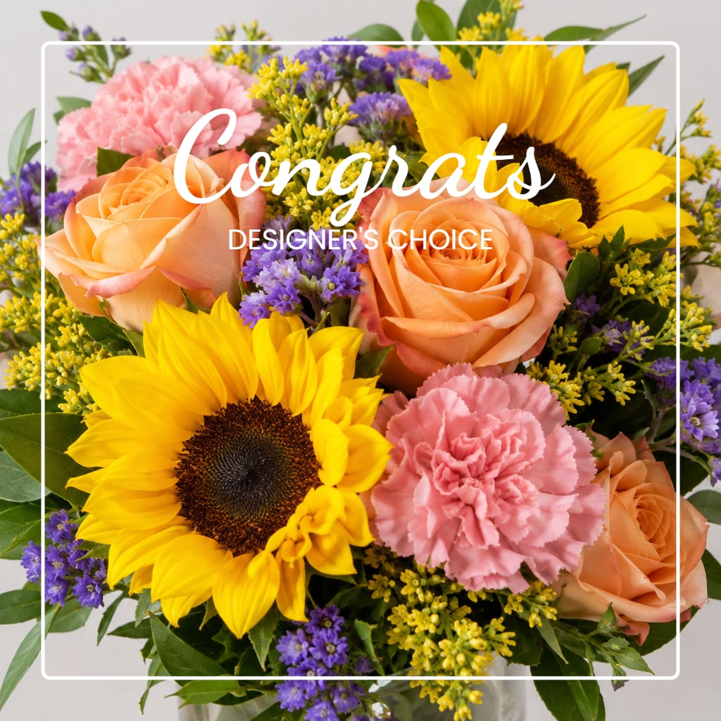 Bouquet of sunflowers, peach roses, pink carnations, and purple filler flowers