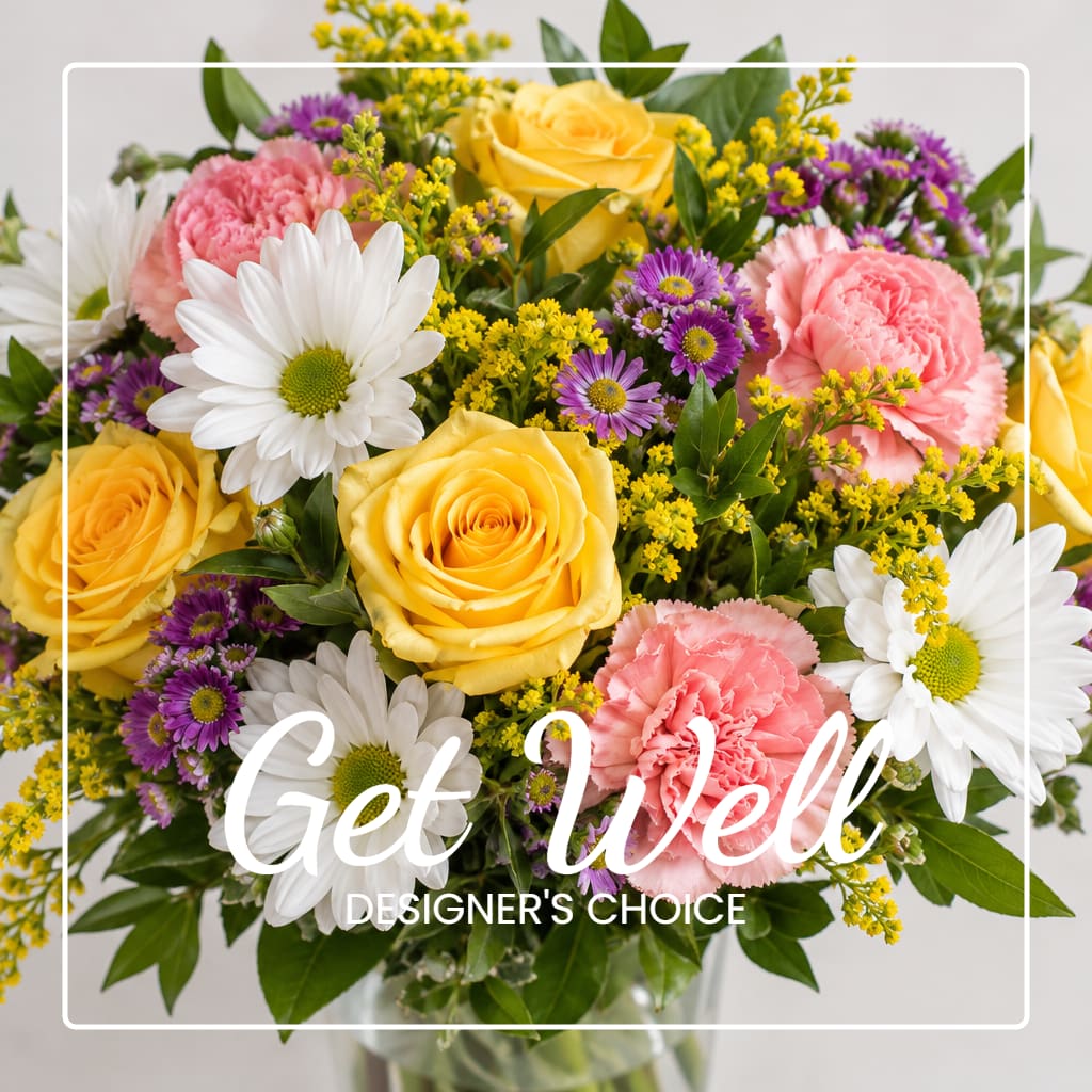 Mixed bouquet of yellow roses, pink carnations, and white daisies