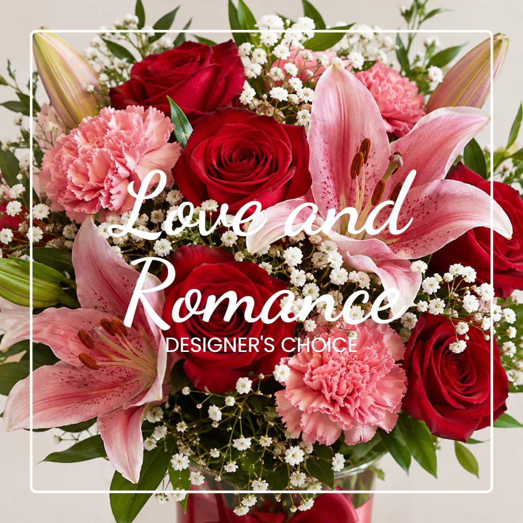Bouquet of red roses, pink lilies, and carnations with white filler flowers