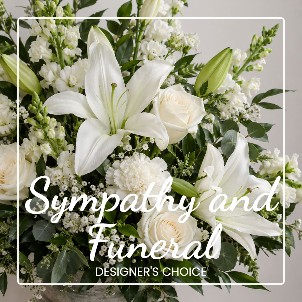 White lilies and roses in a sympathy arrangement with overlaid text