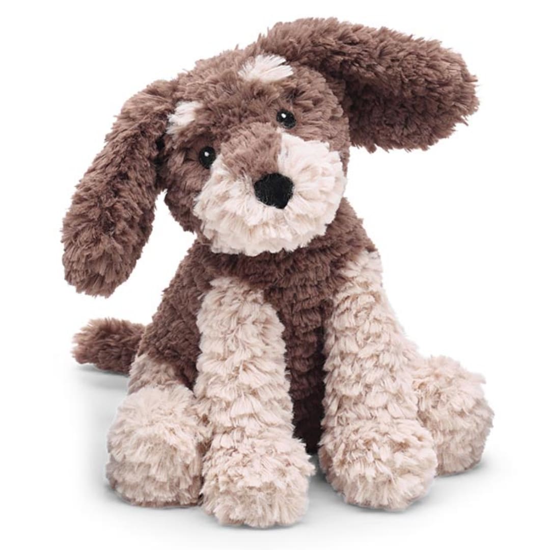 Plush brown and cream stuffed dog sitting on a white background