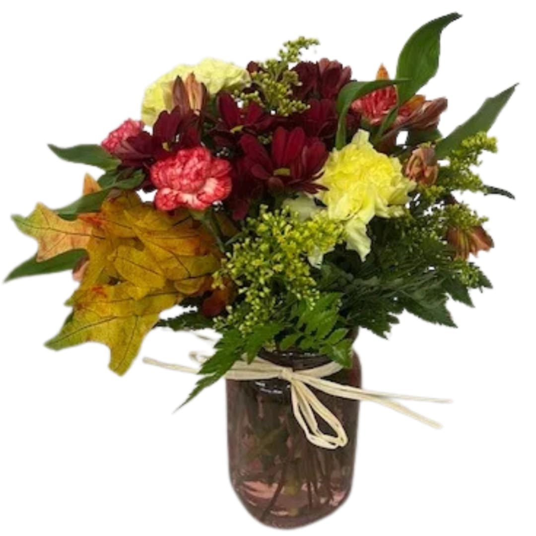 Mixed bouquet in a dark glass vase with a ribbon tie