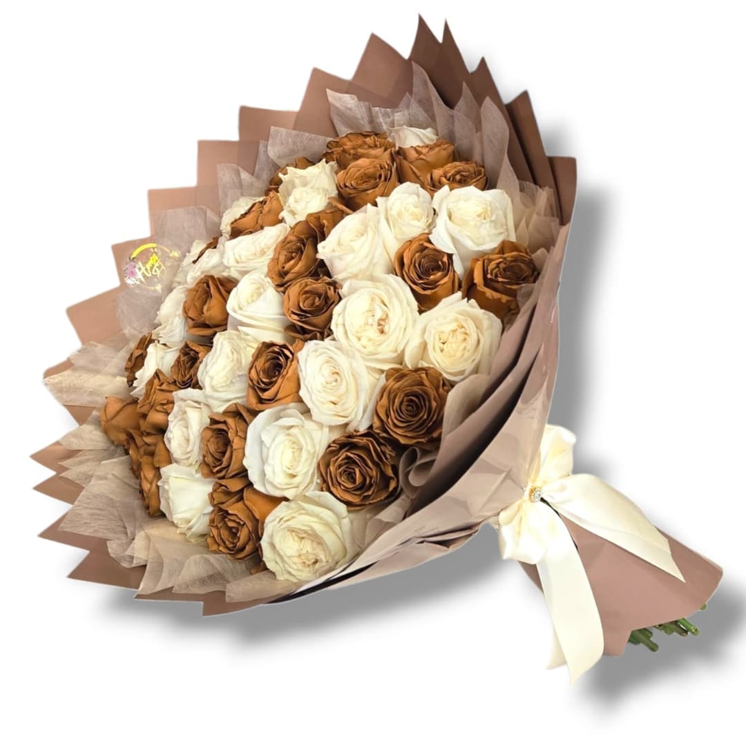 Bouquet of cream and brown roses wrapped in tan paper with a ribbon