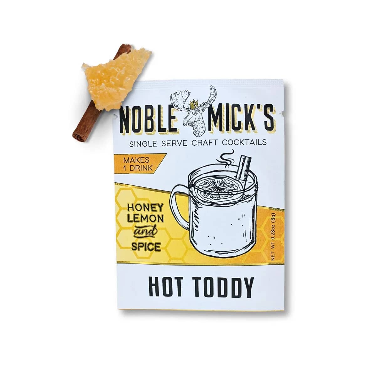 Hot toddy cocktail mix packet with a cinnamon stick and dried citrus garnish