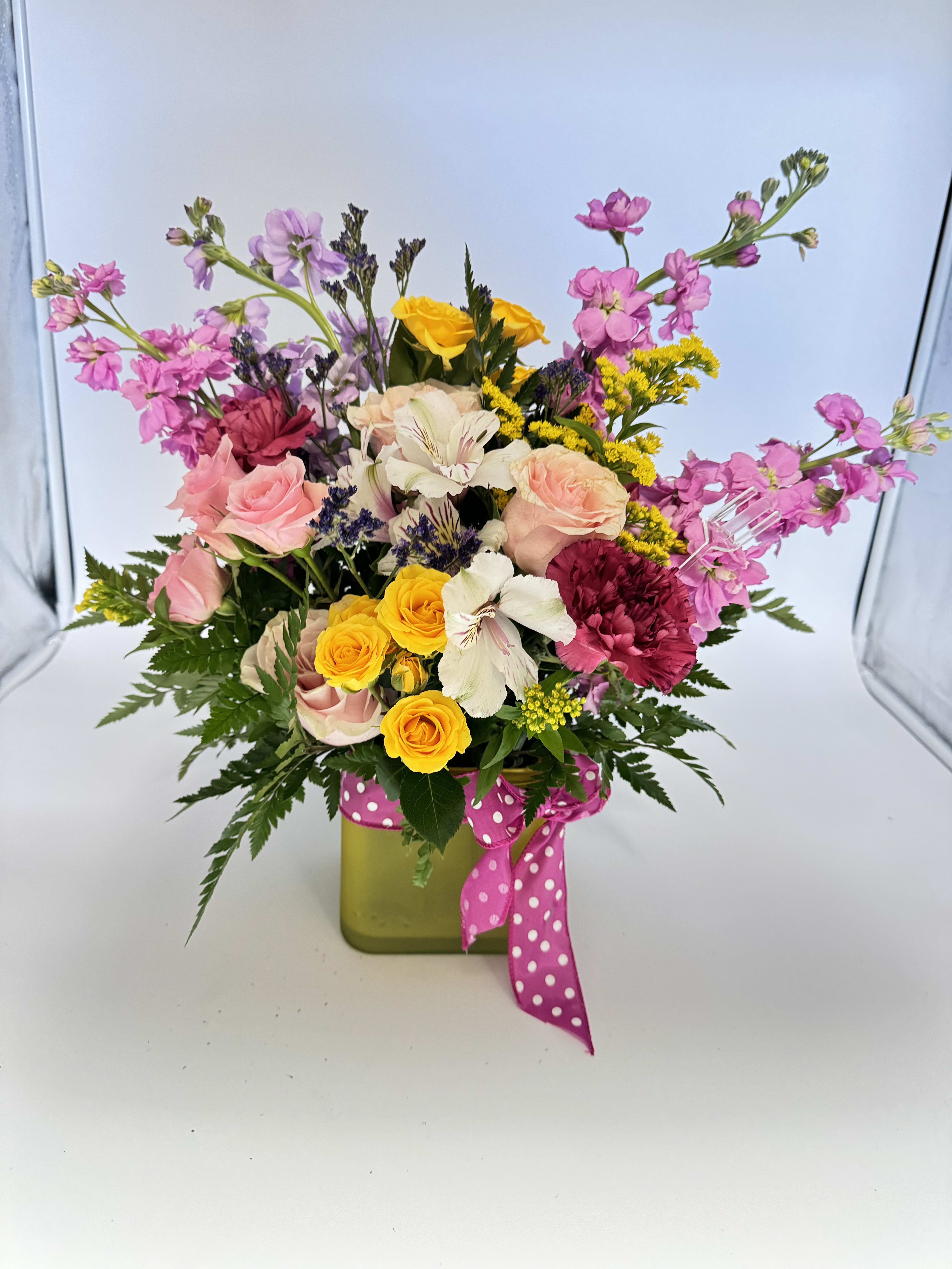 Fantasy cube - “A magical cube filled with colorful and fresh flowers that radiate joy and charm. This beautiful arrangement combines vibrant tones like pink, yellow, orange, and purple, making it a unique and special gift for any occasion.”