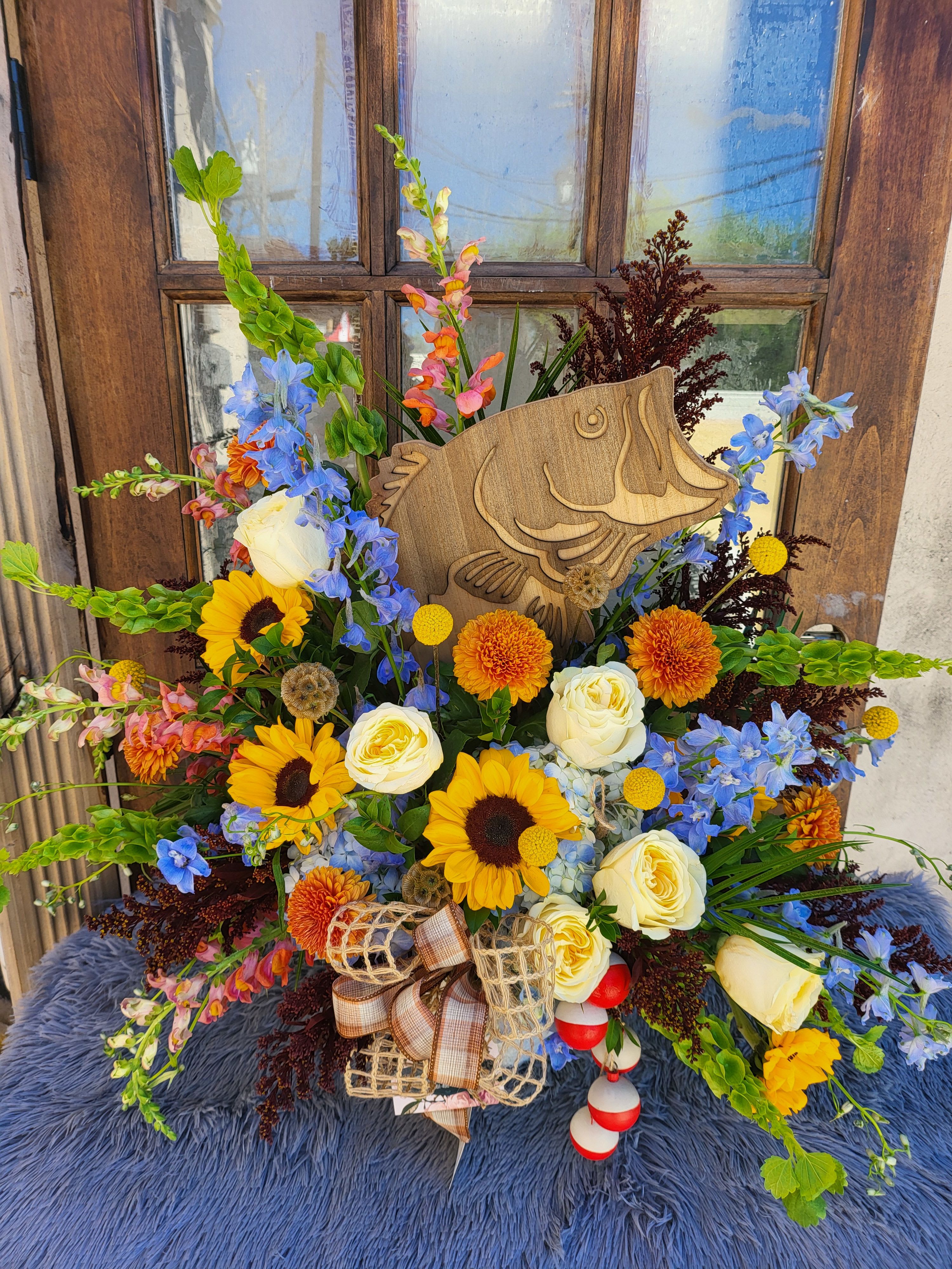 Gone Fishing Basket - By Katherine's Flowers - A beautiful collection of garden flowers &amp; a wooden Bass Fish just the perfect tribute for your loved one or dear friend that always treasure their time fishing and oh all those wonderful stories and memories share.   