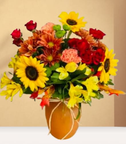 Bouquet of sunflowers, red roses, and orange mums in a vase