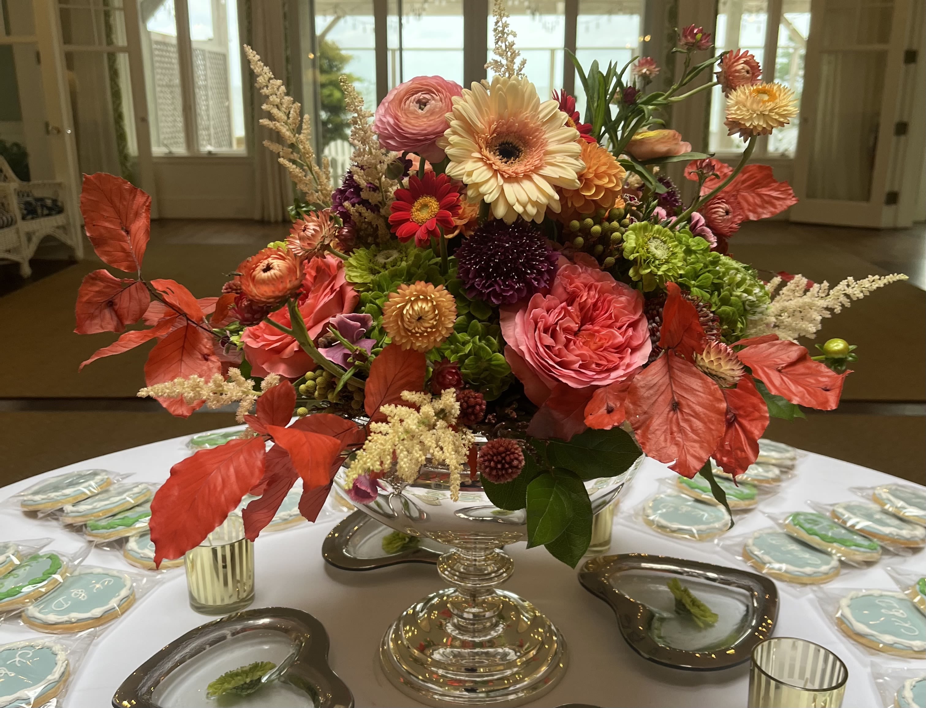 Jubilee - Pedestal bowl filled with mixed premium flowers. 