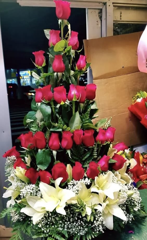 Tiered bouquet of red roses and white lilies