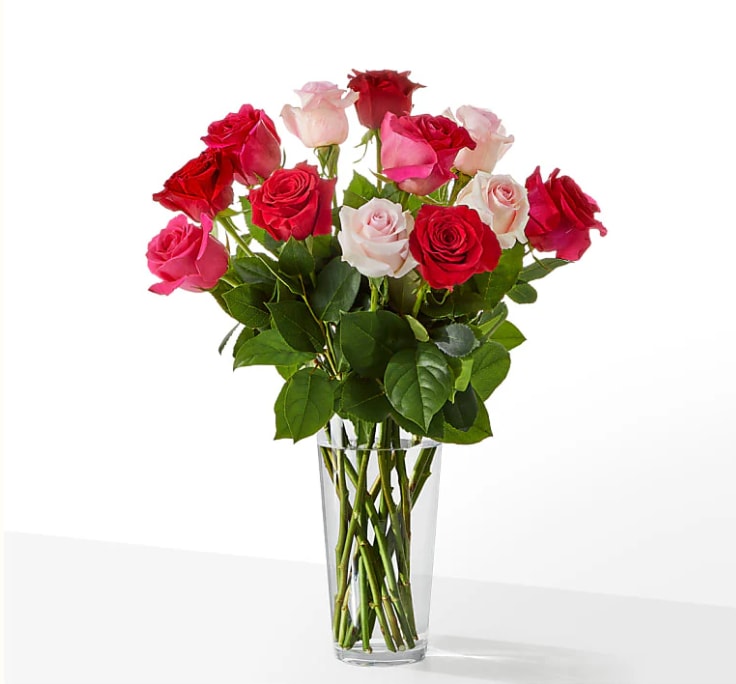 Charming Rose Bouquet - Sweep them off their feet with a gorgeous blend of pink, hot pink and red roses. Sweep them off their feet with a gorgeous blend of pink, hot pink and red roses. Standard 12 Roses  Deluxe     18 Roses Premium 24 Roses 