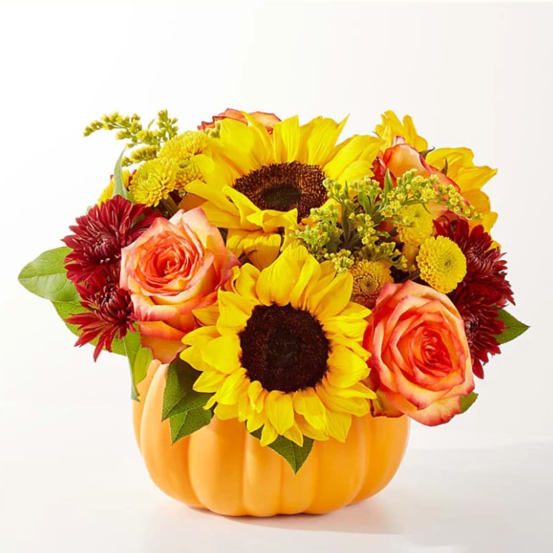 Sunflower and rose arrangement in a pumpkin-shaped container