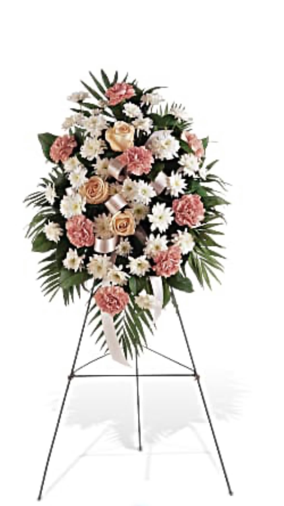 Standing spray of peach roses, pink carnations, and white daisies on a metal easel.