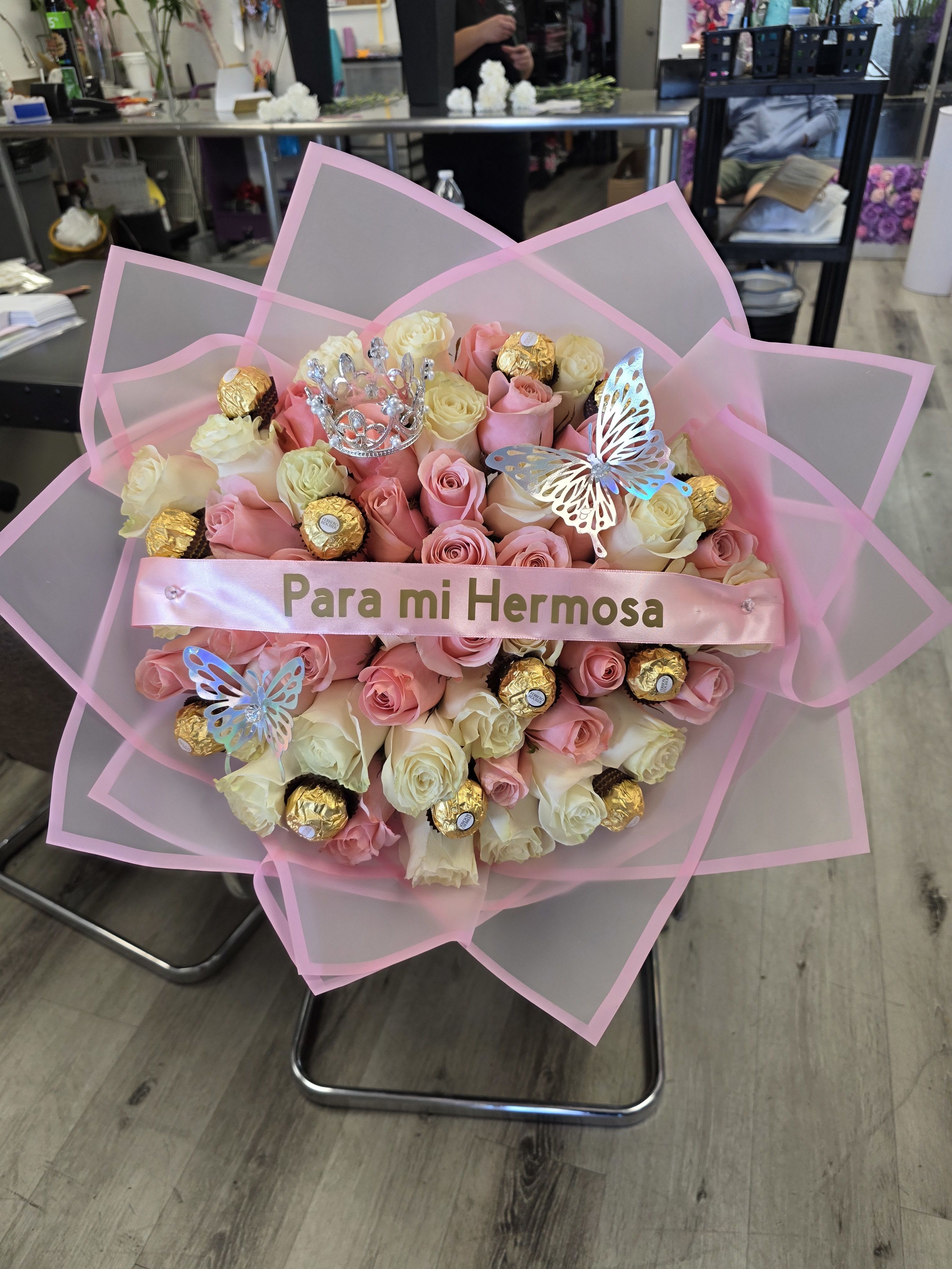 Pink and cream rose bouquet with chocolates and butterfly decorations