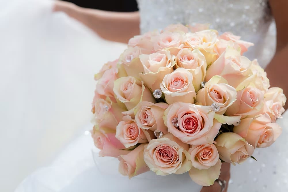 Bouquet of pale pink roses with jeweled accents