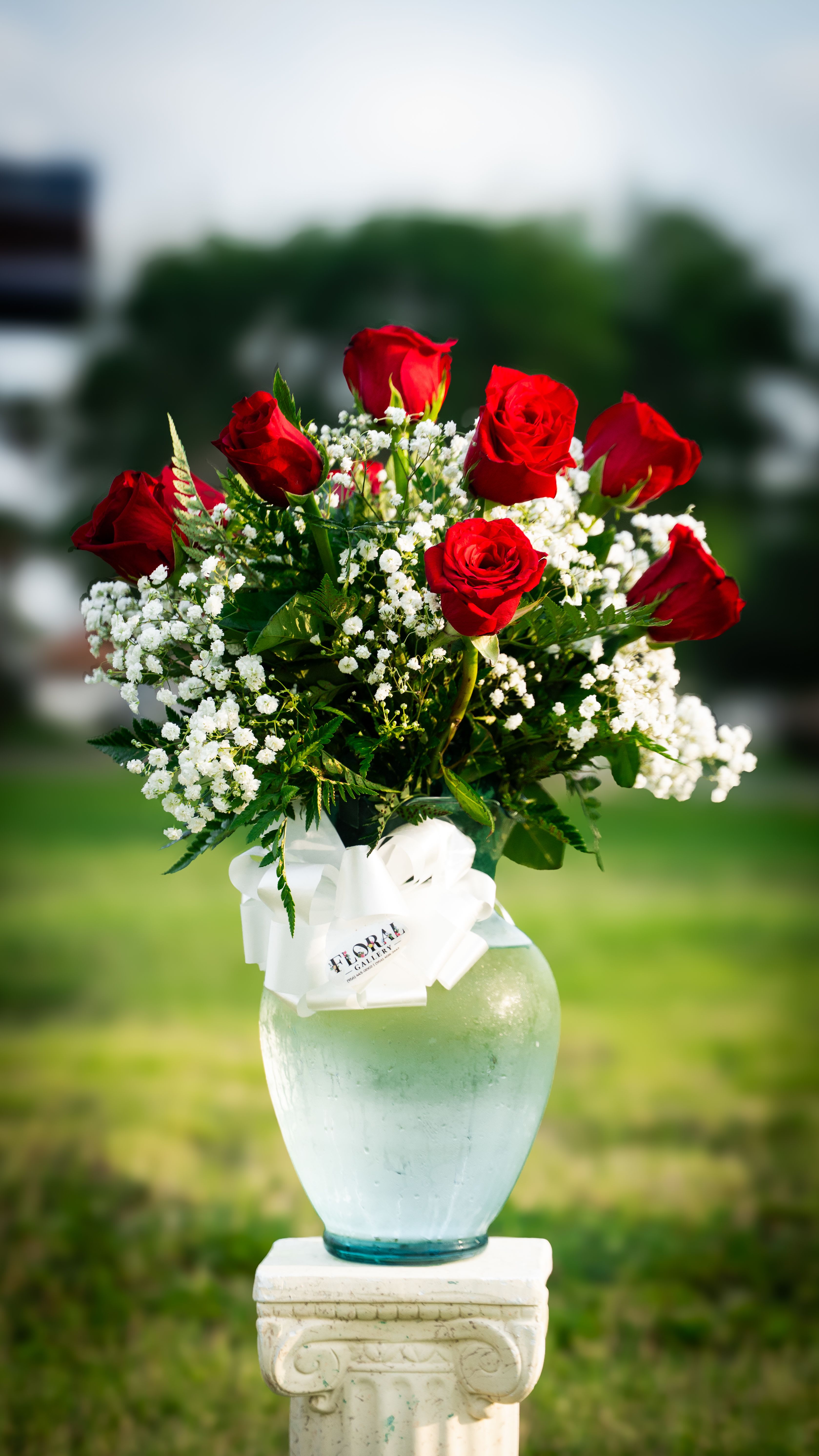 Scarlet Embrace - A passionate arrangement of lush red roses, artfully displayed to capture the timeless essence of love and desire. This bouquet speaks volumes -- a bold, elegant gesture that leaves a lasting impression..