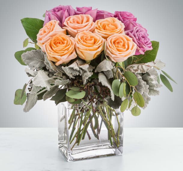 Gemini by BloomNation™ - This luxury arrangement is a lovely and soft rose arrangement that will surely make the recipient gasp. Perfect for Valentine's Day, Anniversaries, or saying "I love you".  Approximate Dimensions: 15"D x 18"H