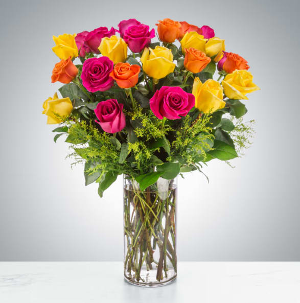 The Sound of Joy by BloomNation™ - Send an explosion of color with this long-stemmed rose arrangement perfect for celebrations or showing your appreciation. A great alternative to the classic red rose, send a giant arrangement of seasonal multicolored bright roses.  Standard (shown).  