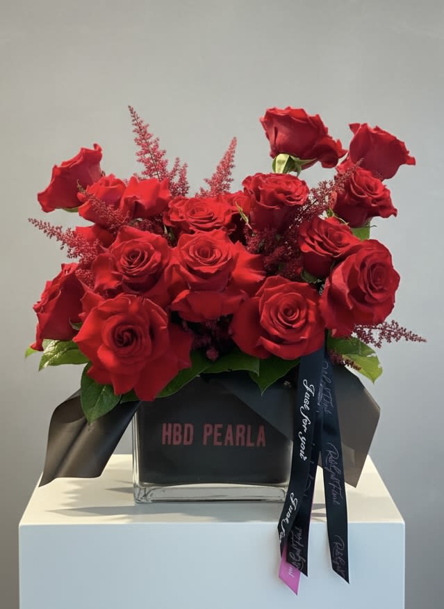 Messenger Rose Bouquet (Select a Color) - Decadent rose bouquet. Standard arrangement is red, but special color requests are welcomed. Place your rose color preference in the order notes and the florist will contact you to confirm availability.   Custom vase message: Place your vase message in notes. 5 word max. 
