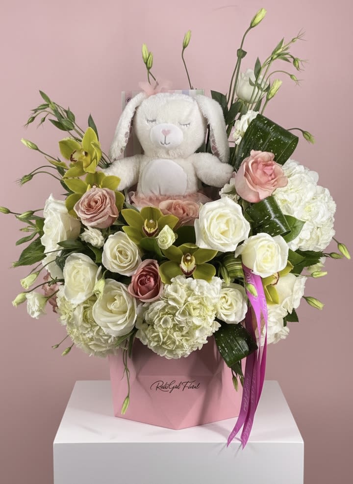 Baby’s first Luxe Box (pink) - Pretty pink luxe box filled with premium orchids, hydrangeas and roses. And a special plush treat on top! 