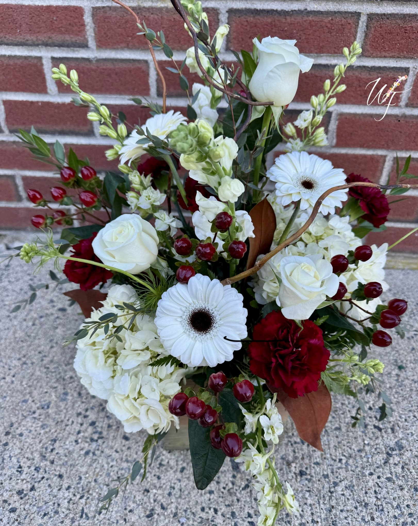 Bouquet of white roses, white gerbera daisies, and red carnations