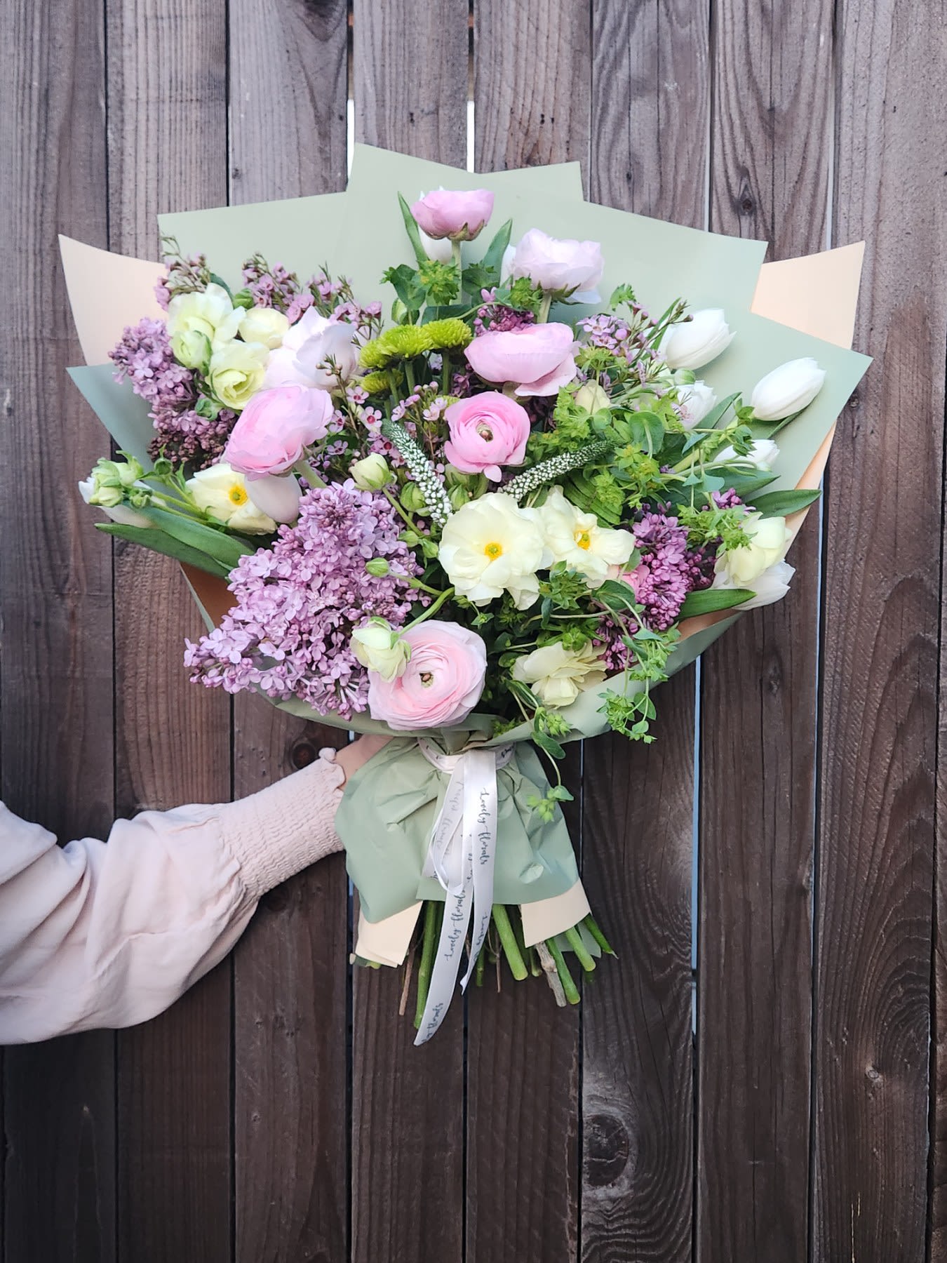Spring Blossom  - Spring Blossom is a vibrant celebration of the season’s renewal, bursting with fresh, pastel-hued blooms that capture the essence of spring. This bouquet features a charming mix of delicate tulips, ranunculus, and lilacs ( Lilacs is available in the moth of may. Otherwise lilac will be substituted with  lavender Stock)