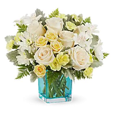 White roses and daisies arranged in a blue glass vase