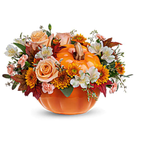 Hello Pumpkin Bouquet  - Beautiful Fall Arrangement in Orange Pumpkin with elegant light orange roses, white spray roses, white alstroemeria, mini carnations peach, cushion chrysanthemums bronze, seeded eucalyptus and some fall leaves.
