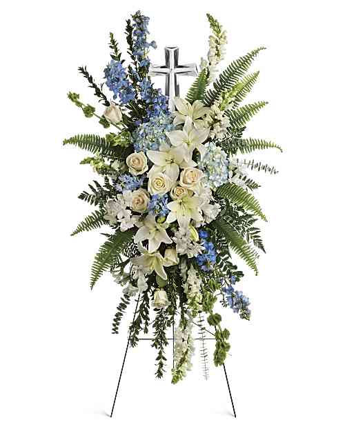 Eternal Grace Spray - This serene spray includes blue hydrangea,crème roses, white asiatic lilies, white alstroemeria, bells of Ireland, blue delphinium, white snapdragons, myrtle, sword fern, leatherleaf fern, spiral eucalyptus, and variegated pittorsporum. 