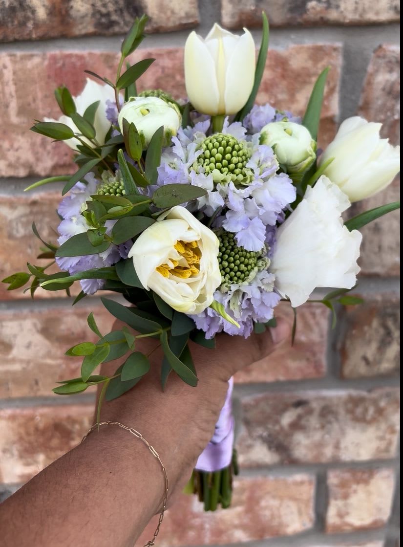 Dance Floor Daisy  - A sweet petite posey of white tulips, lavender scabiosa, lisianthus, and ranunculus. Wrapped in the ribbon of your choice — made to shine under the Friday night lights