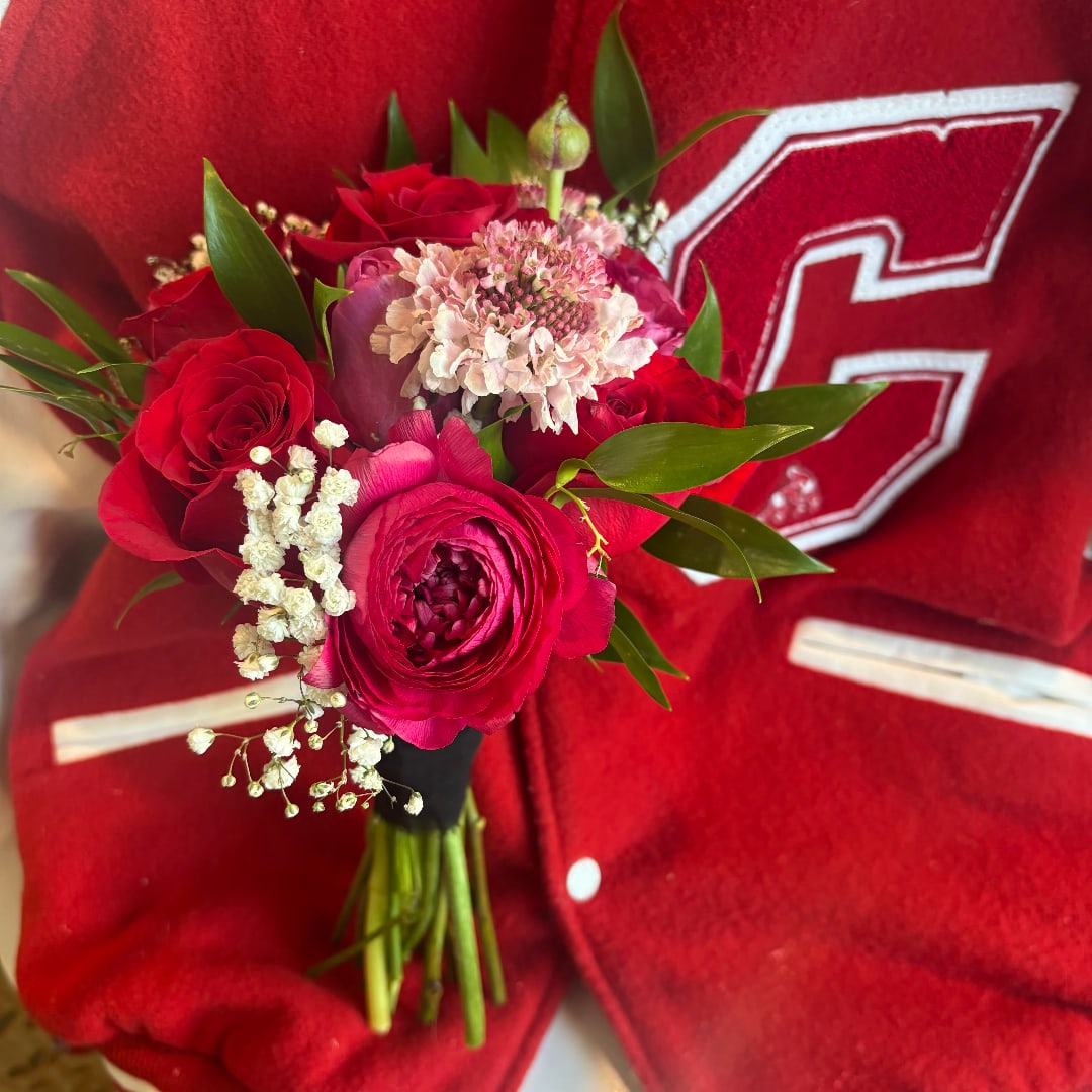 Red rose bouquet with pink and white filler flowers