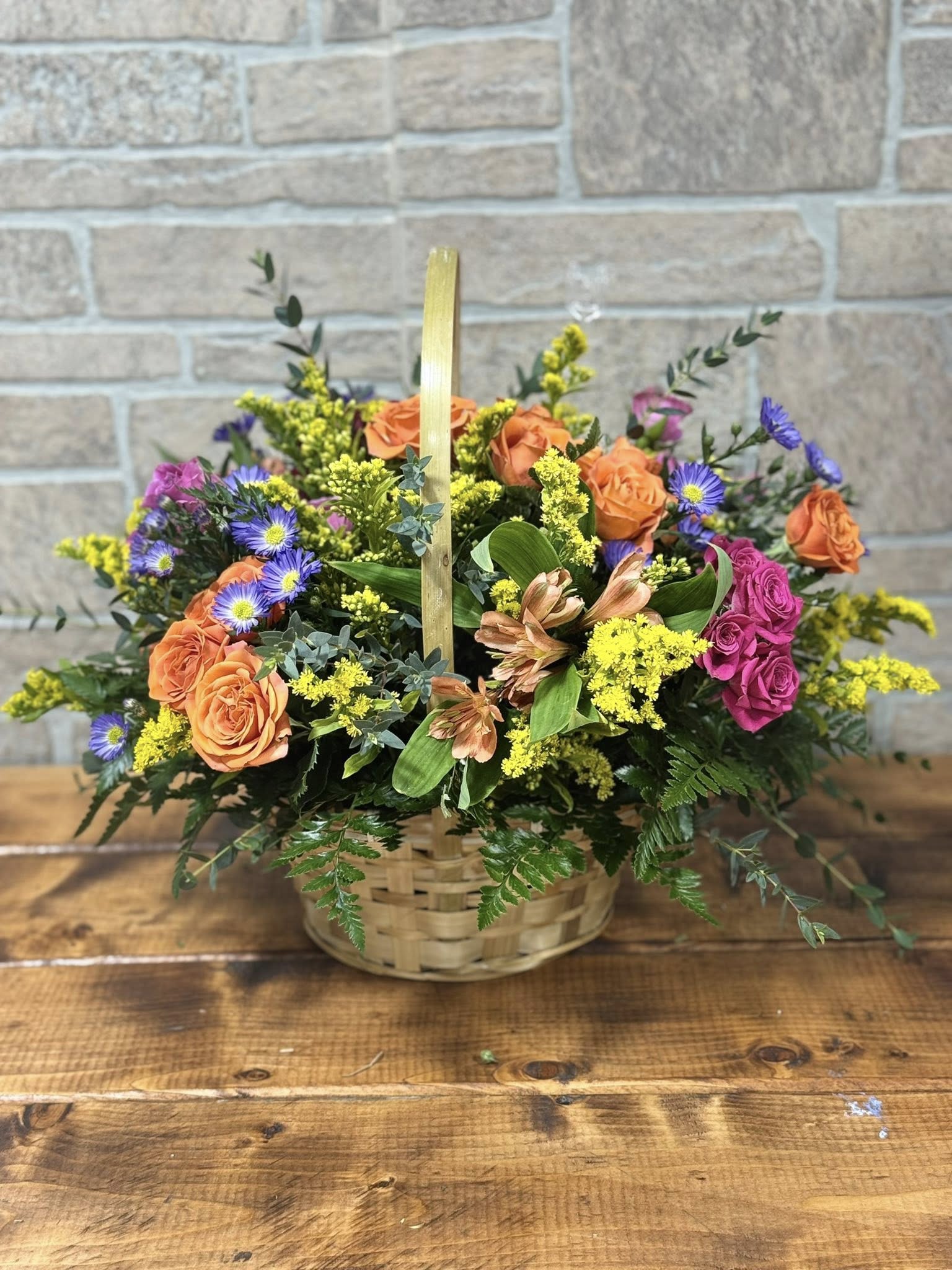 Garden Blessings Basket - Bring warmth and natural beauty to any occasion with the Garden Blessings Basket, a charming mixed floral arrangement designed in a classic basket style. Filled with fresh seasonal blooms and lush greenery, this garden-inspired design offers a beautiful blend of color, texture, and fragrance.  Perfect for birthdays, get-well wishes, sympathy gestures, or everyday surprises, the Garden Blessings Basket delivers heartfelt sentiment with a fresh, uplifting feel. Each basket is thoughtfully arranged by Blessings In Bloom Florals to reflect the beauty of a blooming garden and the joy of sharing flowers with those you love.  Flower varieties and colors may vary based on seasonal availability while maintaining the overall style and value of the arrangement. 