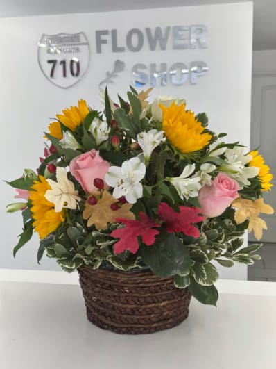 Bloom Basket by BloomNation™ - We all love picnic baskets. What about flower baskets? Instead of being filled with nourishing food, this Bloom Basket nourishes the soul! Nourish your soul, or the soul of a loved one, with a few servings of autumn wonderment with this Bloom Basket. You will not regret it. Substitutions: If some flowers and/or the vase are not available there will be minor substitutions.