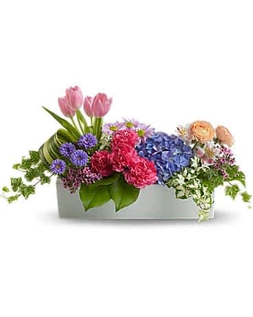 Mixed bouquet in a rectangular white box with pink tulips and blue hydrangeas